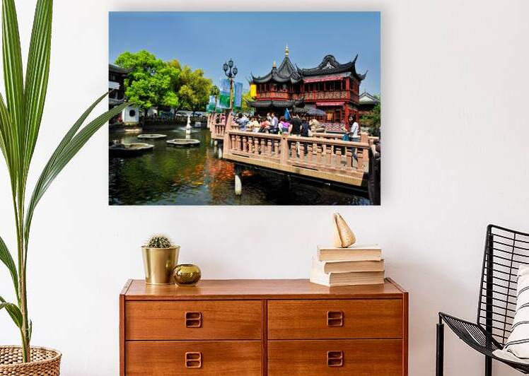 Vibrant Chinese garden with koi pond and visitors in Shanghai by Marco Brivio