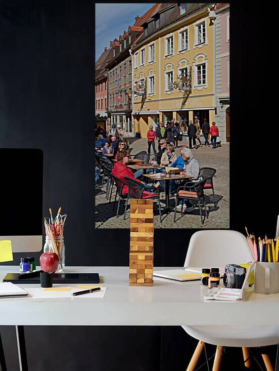 People relax at outdoor cafe in Fussen along the Romantic Road by Marco Brivio