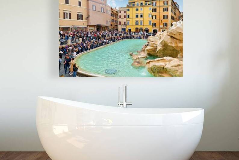 Crowd of tourists visiting Trevi Fountain in Rome during the day by Marco Brivio