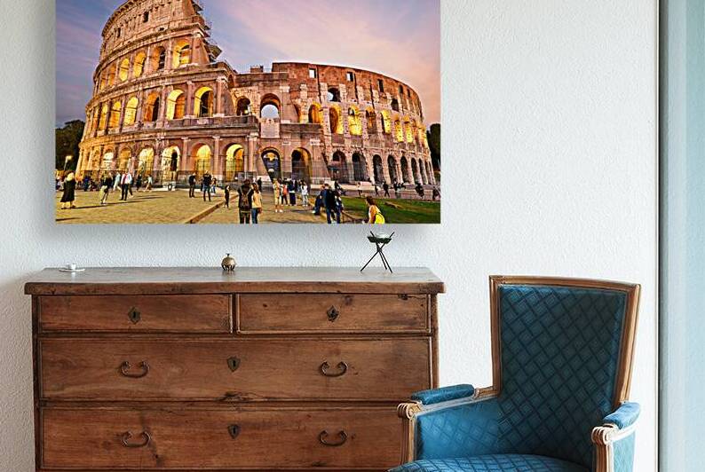 Evening view of Colosseum in Rome with visitors around by Marco Brivio