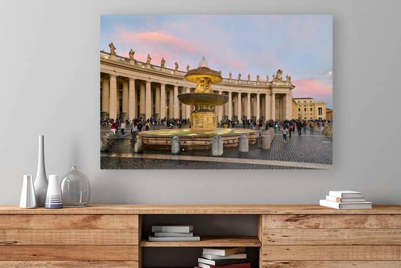 Dusk at Saint Peters Square with people by the fountain by Marco Brivio