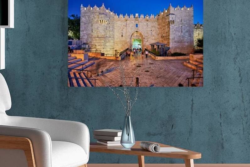 Damascus gate in Jerusalem at sunset with visitors walking nearb by Marco Brivio