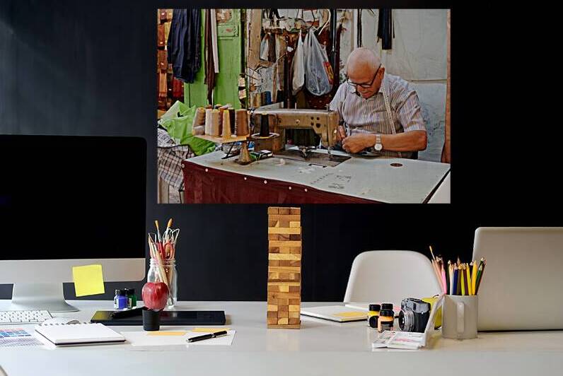 Tailor works in the Jewish quarter of Jerusalem Israel by Marco Brivio