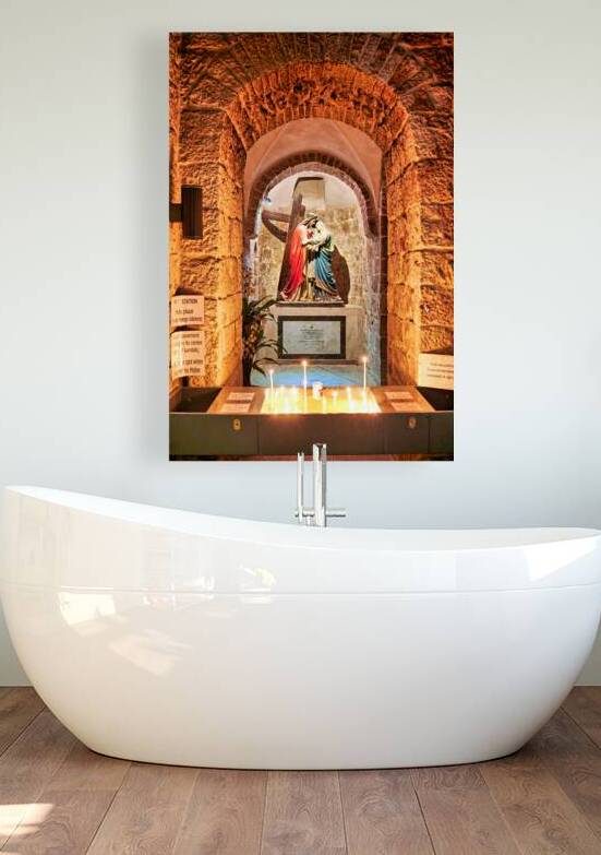 Statue of Mary and Jesus in a chapel with candles by Marco Brivio