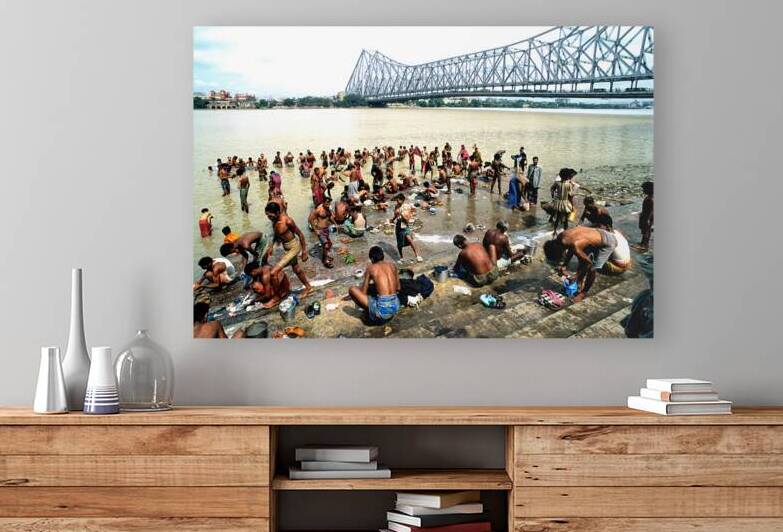 Bathers wash and gather by Hooghly river in Kolkata by Marco Brivio