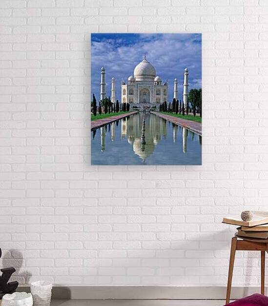 Taj Mahal stands in Agra with clear sky and reflecting pool by Marco Brivio