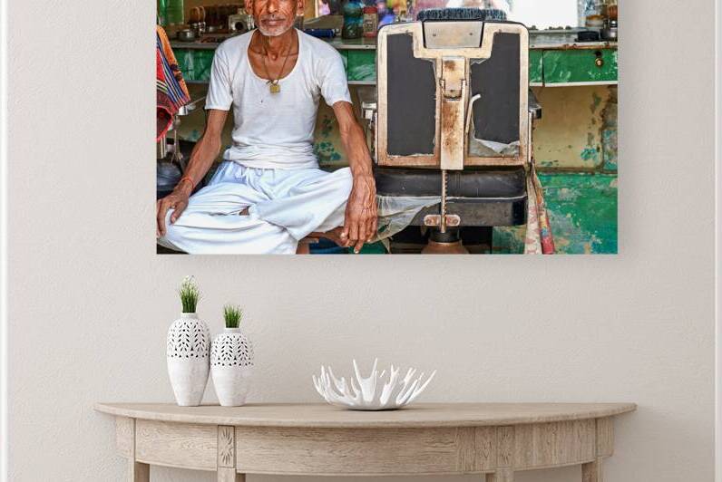 Barber works in shop in Mandawa Shekawati Rajasthan India by Marco Brivio
