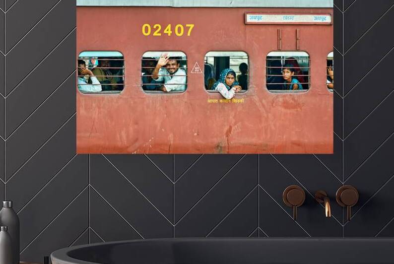 People travel on a train in Rajasthan India during the day by Marco Brivio