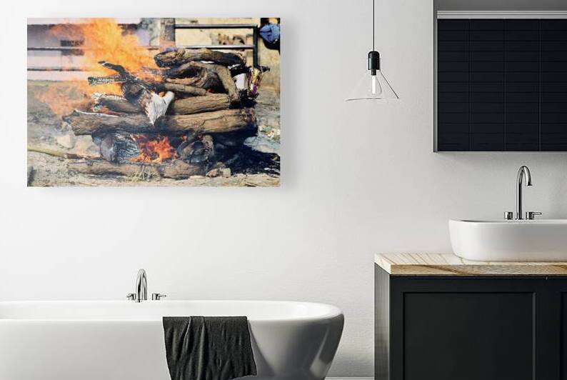 Cremation rite by the Ganges River in Varanasi by Marco Brivio