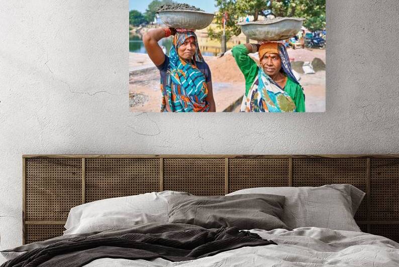 Women carry materials in Varanasi near the river bank by Marco Brivio