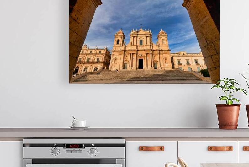 Noto Cathedral stands tall in Noto Sicily with blue sky backdro by Marco Brivio