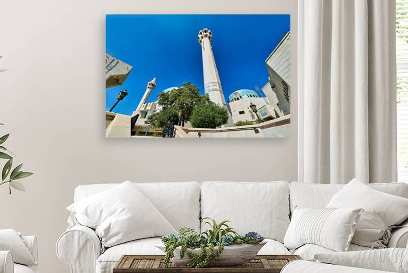 King Abdullah Mosque in Amman Jordan under clear blue sky by Marco Brivio