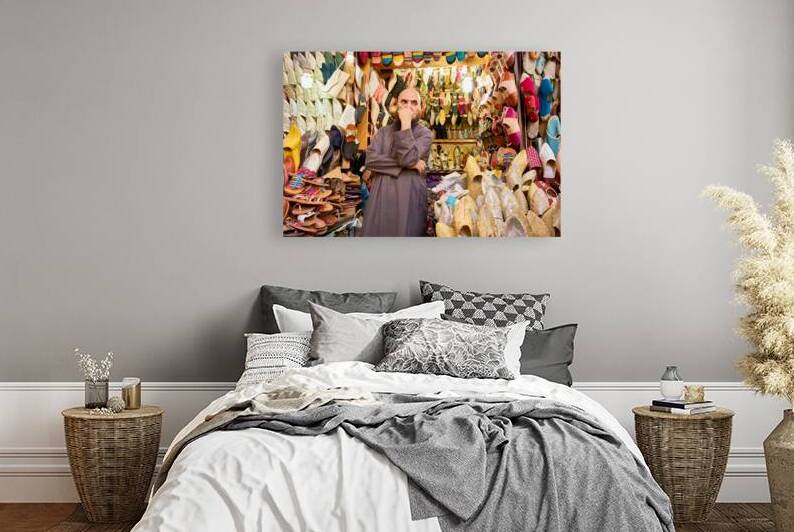 Selling shoes in the Medina of Fez Morocco during a busy market by Marco Brivio