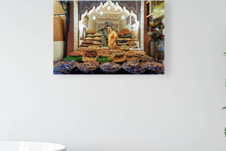 Sale of dried fruit at souk in Marrakesh Morocco by Marco Brivio