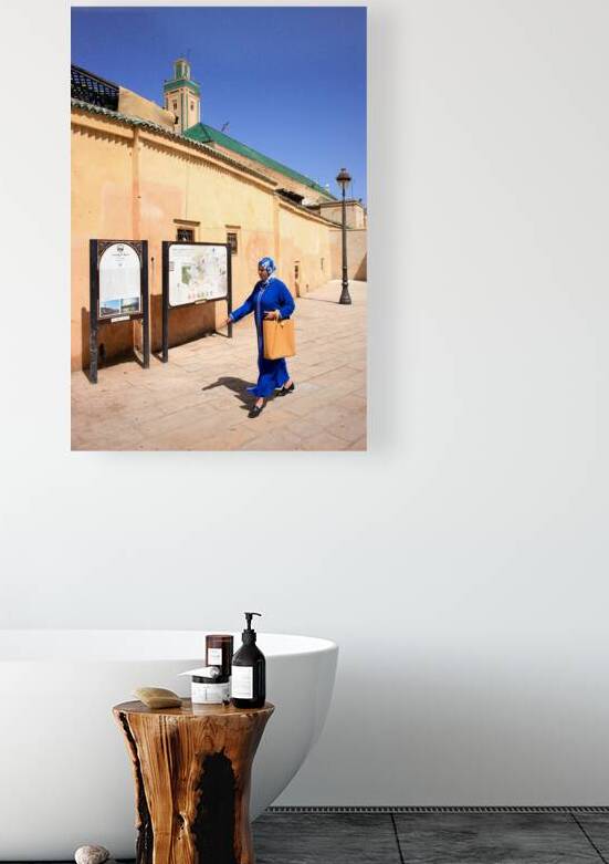 Woman walks in the Medina of Fez Morocco during daytime by Marco Brivio