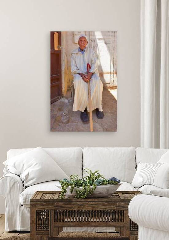 Old man sitting in Meknes Morocco in daylight by Marco Brivio
