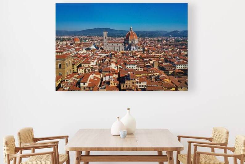 View of Florence with red rooftops under clear sky by Marco Brivio