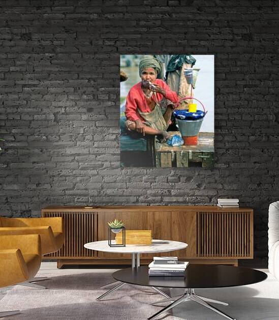 Street market scene in Yangon with a woman smoking and selling g by Marco Brivio