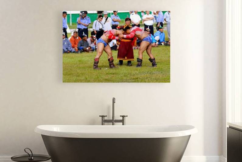 Wrestling matches take place during Naadam festival in Ulaanbaat by Marco Brivio