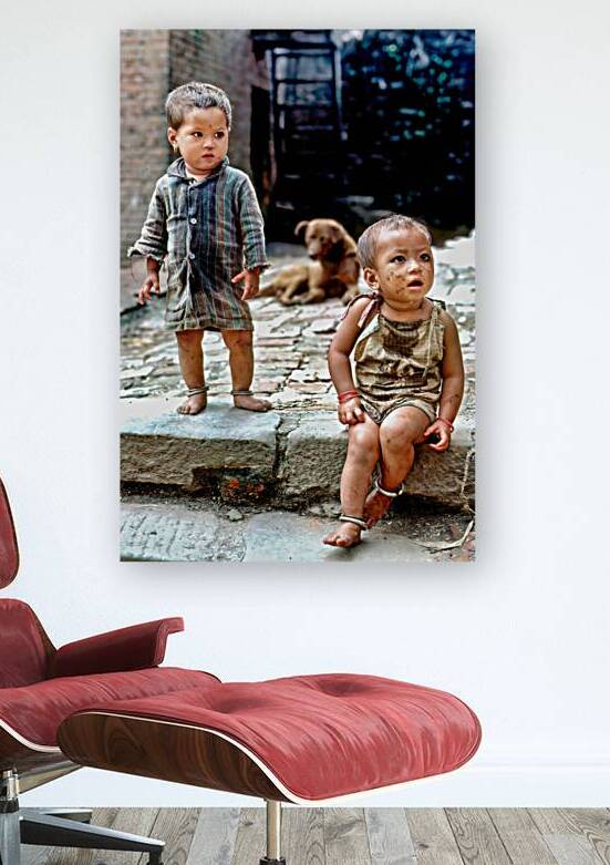 Children playing in a narrow street in Kathmandu Nepal during d by Marco Brivio