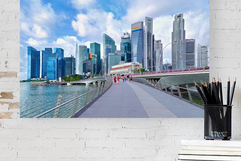 People stroll in Singapores financial district by a bridge by Marco Brivio