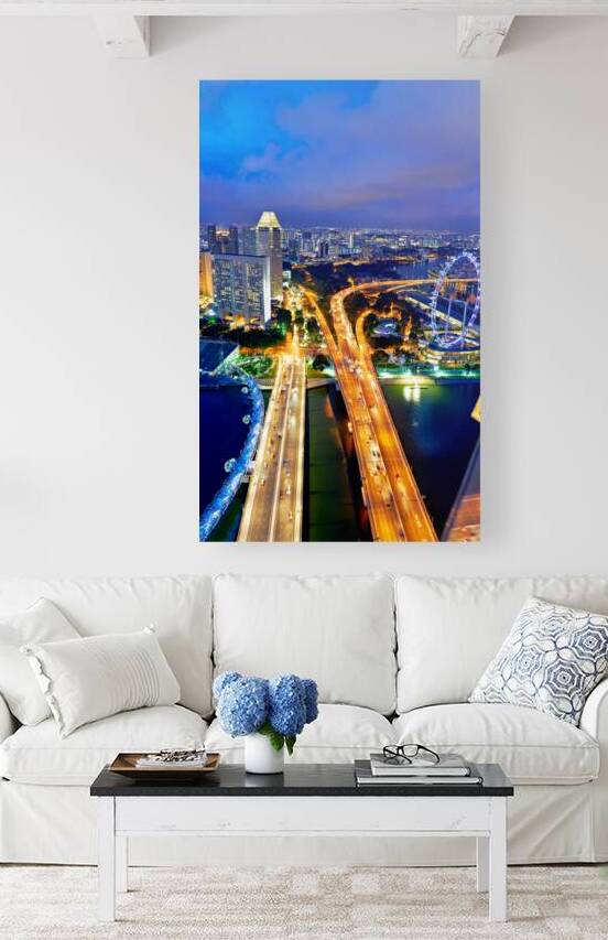 City lights shine in Marina Bay as sunset brings night activity by Marco Brivio