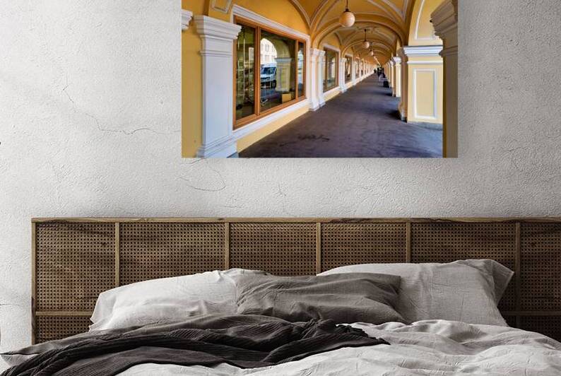 Walking through the arches of Gostinyy dvor in Saint Petersburg by Marco Brivio