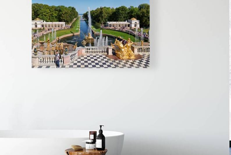 People walk and admire the fountains at Peterhof Palace in St by Marco Brivio