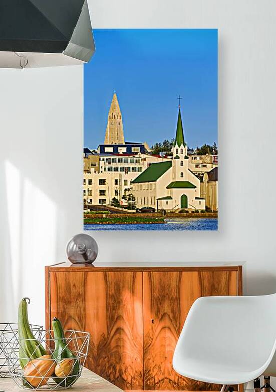 Lutheran free church by lake Tjornin and Halgrimskirkja by Marco Brivio