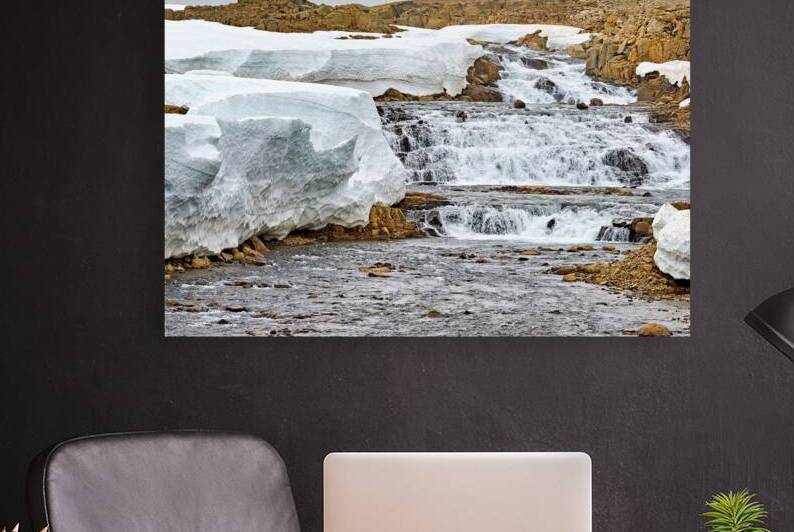 Flowing water and snow near Djupvegur in Iceland by Marco Brivio