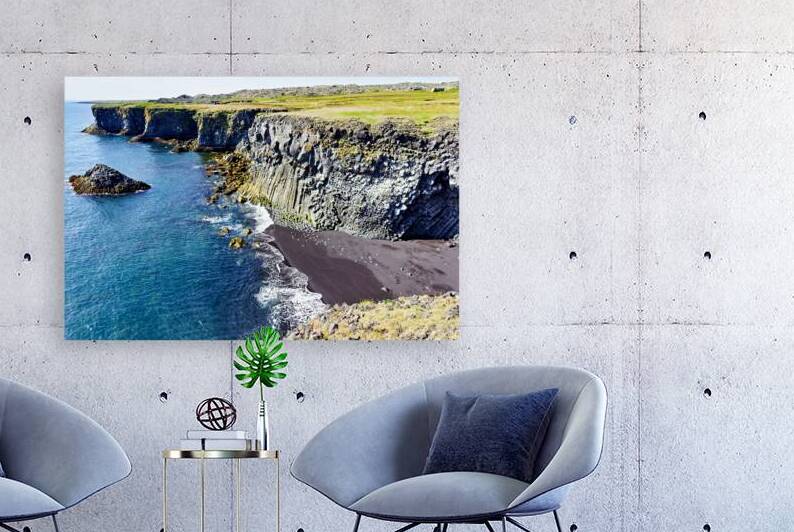 View of Arnarstapi cliffs and black sand beach in Iceland by Marco Brivio