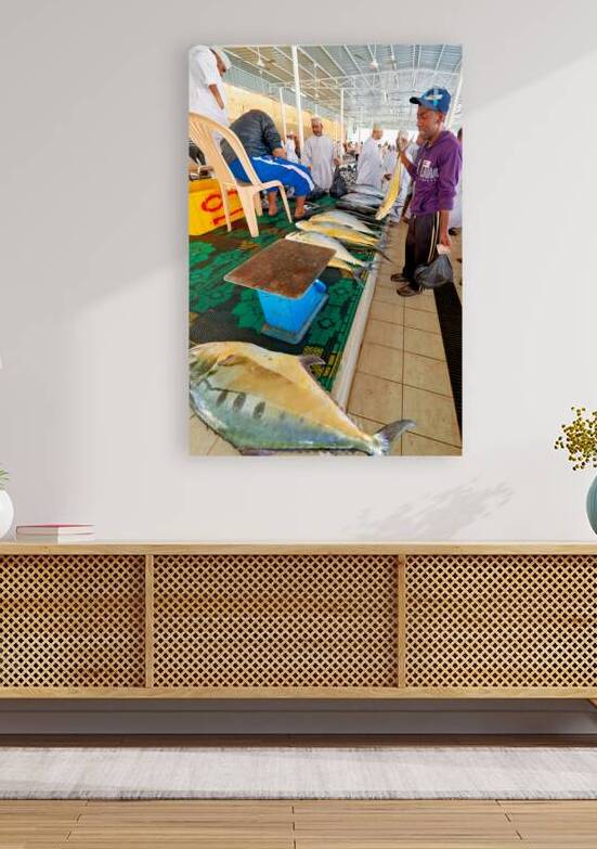 Fish market in Muscat Oman shows local vendors and buyers by Marco Brivio