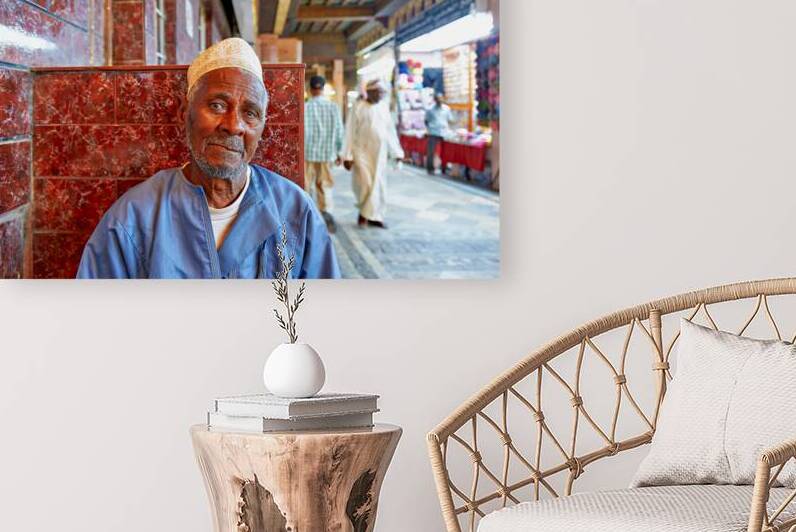 Elderly man resting at the Mutrah Souq in Muscat Oman by Marco Brivio