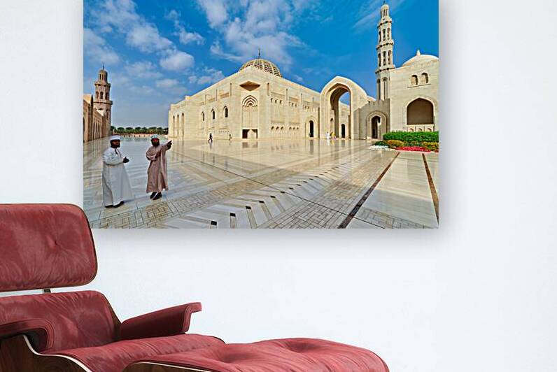 Visitors explore Sultan Qaboos Grand Mosque in Muscat Oman by Marco Brivio