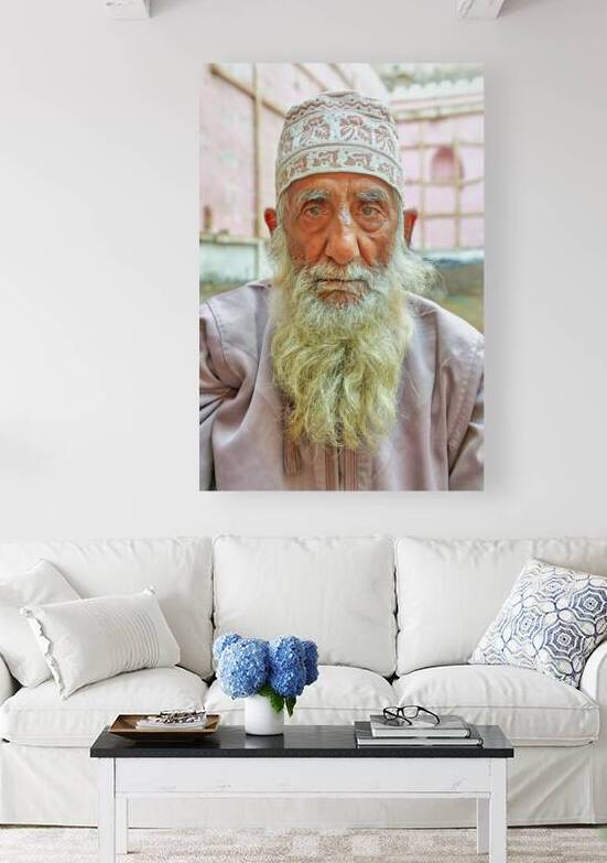 Senior man with white beard in Muscat Oman courtyard by Marco Brivio