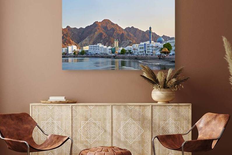 Sunset over Muscat waterfront with mountains behind by Marco Brivio