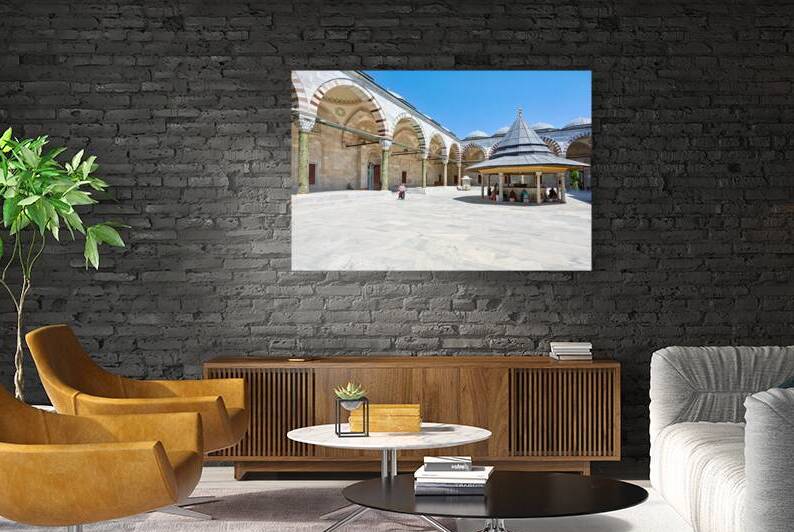 Visitors explore the courtyard at Fatih Mosque in Istanbul by Marco Brivio