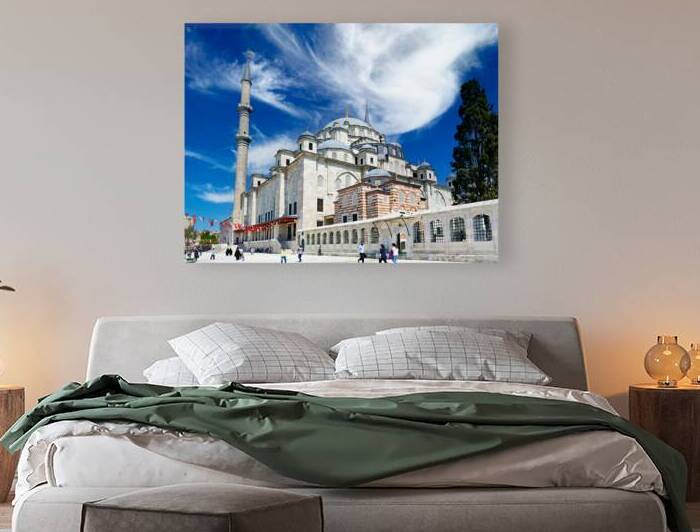 Visitors explore Fatih Mosque in Istanbul on a sunny day by Marco Brivio
