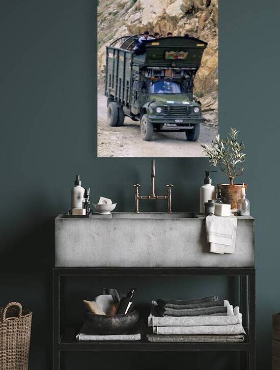 Freight truck carries passengers on rocky road in Pakistan by Marco Brivio