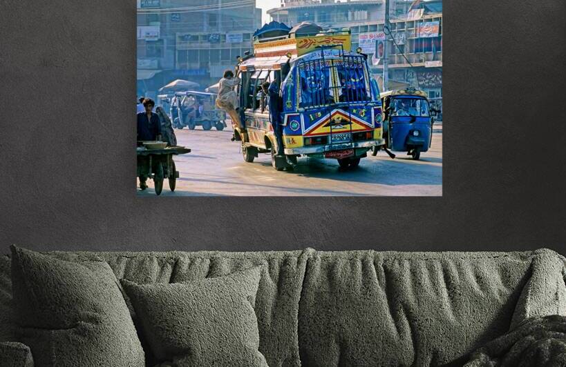 Busy streets of Peshawar with colorful buses and rickshaws by Marco Brivio