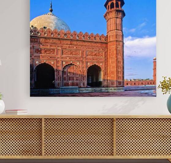 Badshahi mosque stands in Lahore under clear blue sky by Marco Brivio