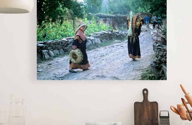 Women working in Bumburet Valley Kalash village by Marco Brivio