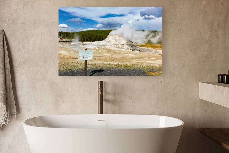 Castle Geyser erupts steam in Yellowstone National Park by Marco Brivio
