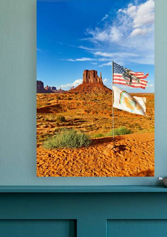 Monument Valley displays flags under blue sky in USA by Marco Brivio