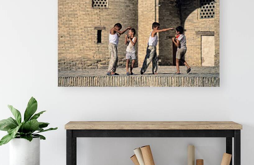 Children playing together in Bukhara Uzbekistan by Marco Brivio