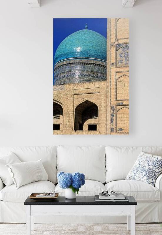 Bukhara features blue dome of historical mosque during daylight by Marco Brivio