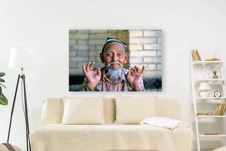 Elderly man showing hand gestures in Khiva Uzbekistan by Marco Brivio