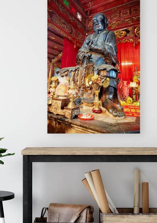 Statue of a monk in Ho Chi Minh City with traditional offerings by Marco Brivio