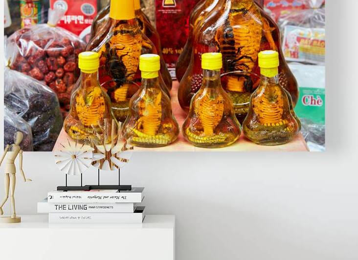 Bottles of snake alcohol in Ho Chi Minh City market by Marco Brivio