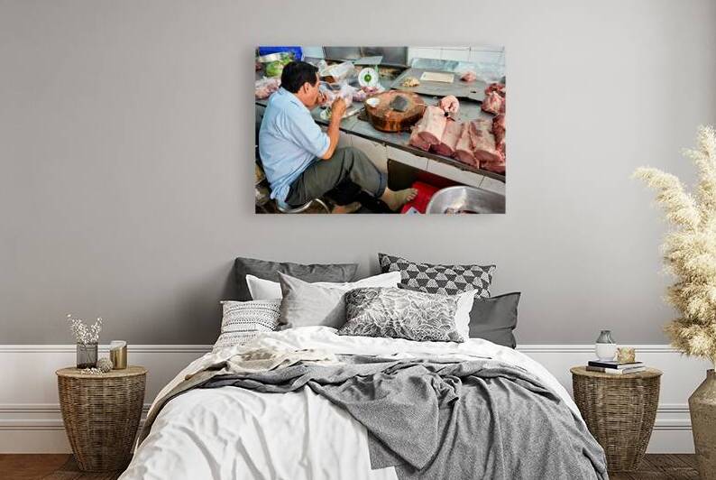 Meat vendor prepares pork at market in Ho Chi Minh City by Marco Brivio